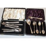 A silver-plated cased double nutcracker set with picks and a small selection of various silver