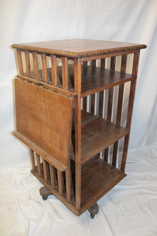 A late Victorian oak square revolving book stand with attached folding reading stand, - Image 2 of 2