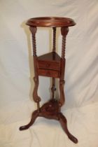 A reproduction mahogany traditional shaving stand with two small centre drawers