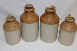 Two pairs of stoneware flagons from E. G.
