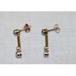 A pair of unmarked gold Art Deco-style droplet earrings mounted with diamonds (3g)