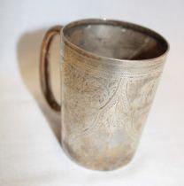 A small silver Christening tankard with engraved decoration and presentation text,