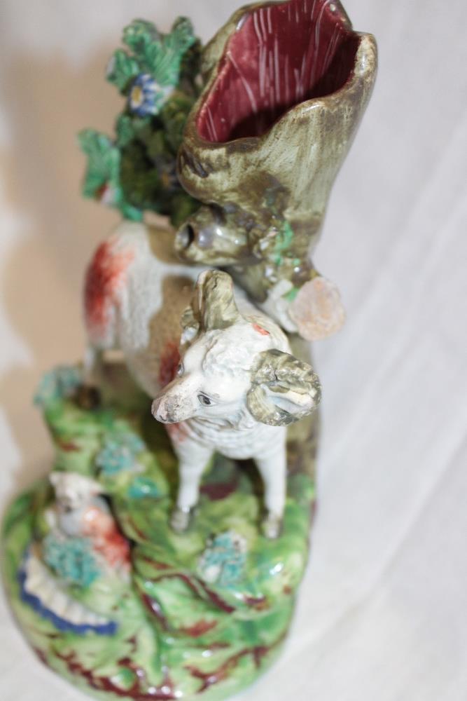 A 19th century Staffordshire pottery figure by Walton depicting a sheep and lamb below a tree trunk - Image 2 of 2