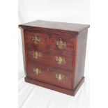 A small mahogany table chest with brass handles,