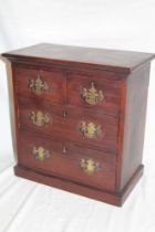 A small mahogany table chest with brass handles,