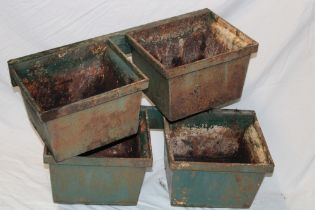 Two matching pairs of 19th century cast-iron gutter hoppers mounted on wooden brackets,