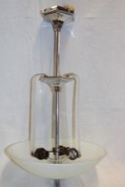 An Art Deco chromium plated ceiling light with opaque glass inverted domed shade,