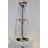 An Art Deco chromium plated ceiling light with opaque glass inverted domed shade,