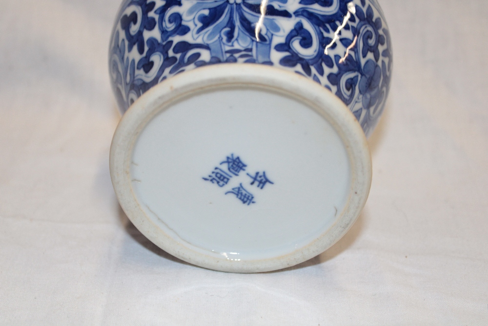 A 19th century Chinese tapered vase with blue and white floral decoration, signed, - Image 2 of 2