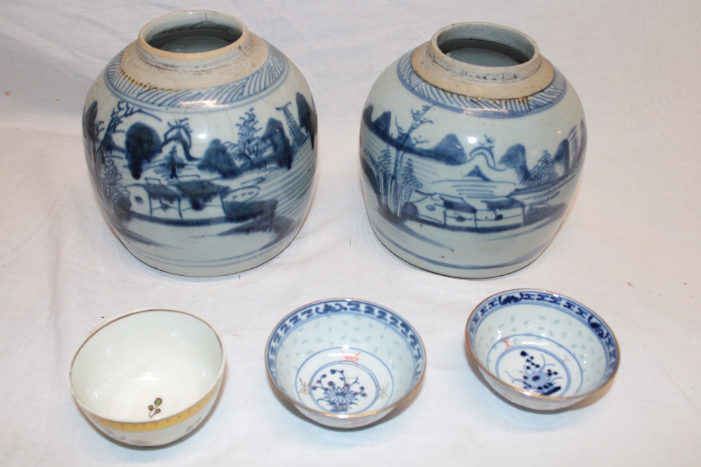 A pair of 19th century Chinese pottery ginger jars with blue and white landscape decoration,