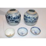 A pair of 19th century Chinese pottery ginger jars with blue and white landscape decoration,