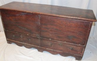 A George III country-style elm mule chest with two base drawers and hinged lid on bracket-style