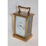 A good quality carriage clock by Imperial with Morocco leather travelling case with rectangular