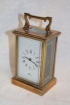 A good quality carriage clock by Imperial with Morocco leather travelling case with rectangular