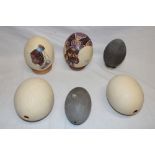 Four various ostrich eggs including two painted eggs "Zulu Beauty" and two other emu eggs (6)