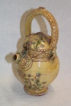 An old Mediterranean-style water flagon with floral decoration 10" high