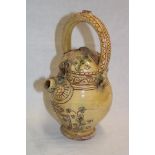 An old Mediterranean-style water flagon with floral decoration 10" high