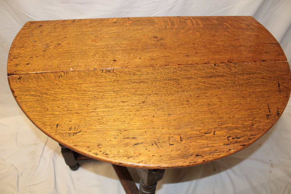 A Charles II and later oak oval gate-leg dining table on bobbin turned supports, - Image 3 of 3