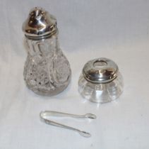 A cut-glass suger sifter with silver mounted top,
