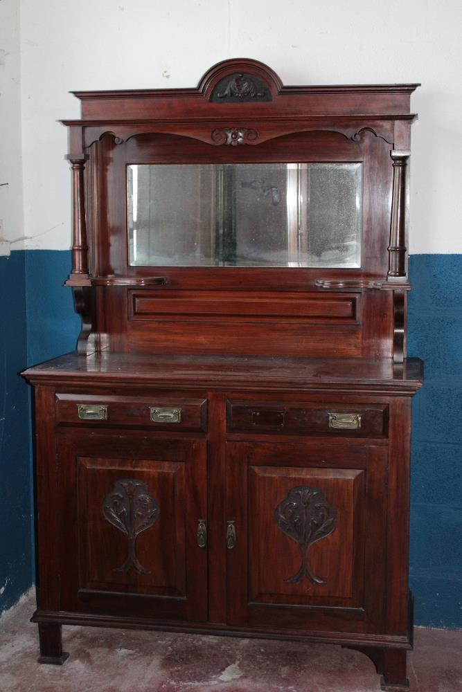 A Victorian Art Nouveau walnut sideboard with mirror back,