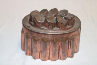 A Victoria copper oval jelly mould with raised geometric decoration,
