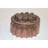 A Victoria copper oval jelly mould with raised geometric decoration,