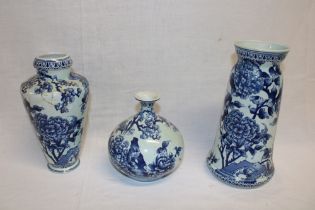 Three various Delft pottery tapered vases with blue and white floral decoration (one af)