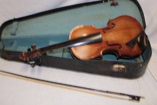 An old violin with 14" figured one-piece back in fitted case with bow