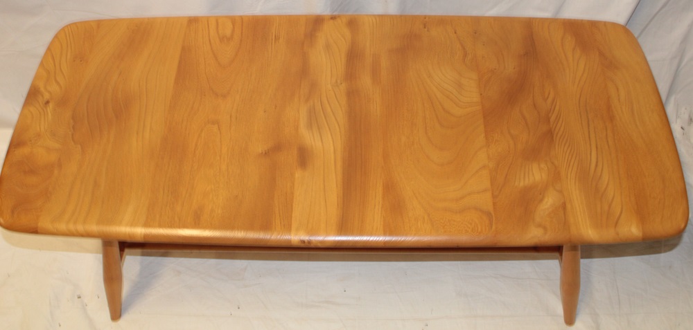 A 1960's/70's Ercol pale elm coffee table with magazine rack on tapered legs, - Image 2 of 2
