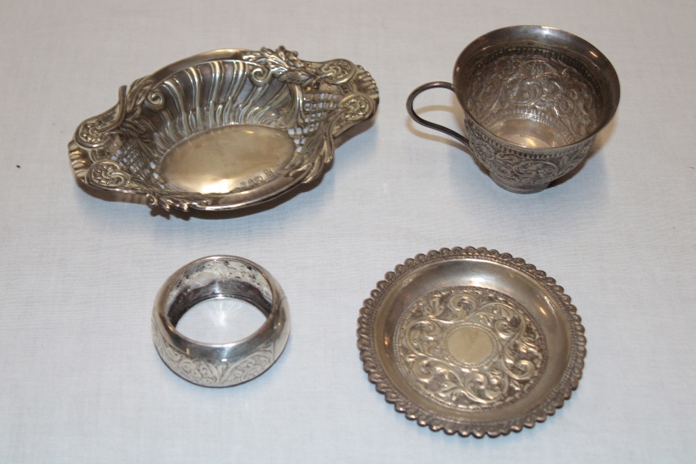 A small silver sweet meat dish with raised and pierced scroll decoration;