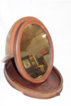 An old mahogany campaign-style folding oval toilet mirror 19" long overall