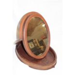 An old mahogany campaign-style folding oval toilet mirror 19" long overall