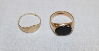 A small 9ct gold signet-style ring set a black stone and one other 9ct gold small ring with heart