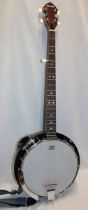 A good quality five string banjo by Remo