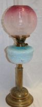 A Victorian brass oil lamp with column stem,