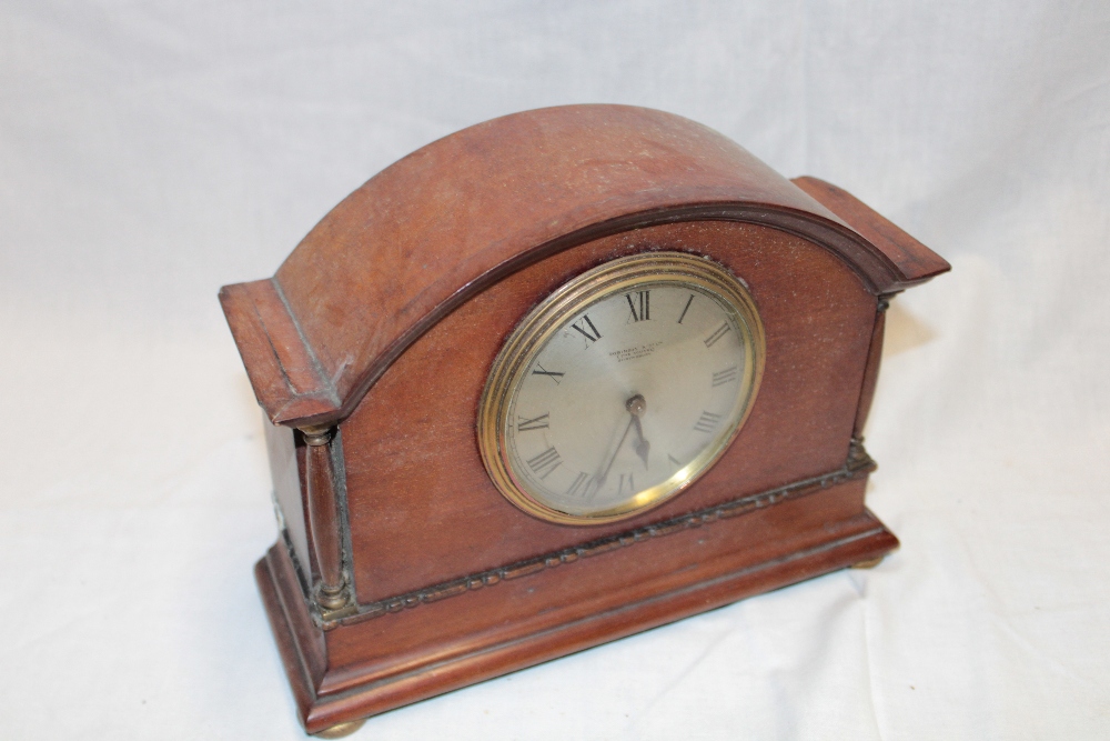 A good quality mantel clock with silvered circular dial by Robinson & Co.