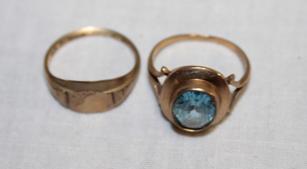 A 9ct gold dress ring set a blue stone and a 9ct gold signet-style dress ring with engraved