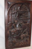 A Continental carved wood plaque depicting a deer hunting scene,