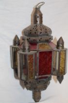 An unusual brass hanging pulpit lamp with red, amber and clear tinted glass panels,