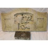 An old carved marble arched panel depicting a hand with flowers,
