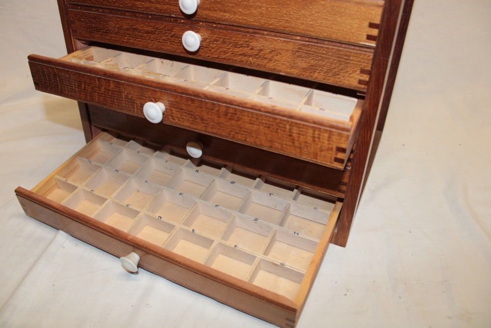 A stained wood table top collector's cabinet of six shallow fitted drawers, - Image 2 of 3