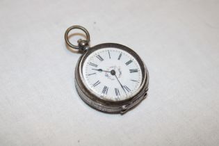 A ladies silver cased fob watch with circular enamelled dial