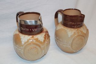 A pair of 19th century Doulton Lambeth pottery Victorian commemorative graduated jugs "Victorian
