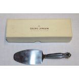 A Danish silver serving slice by Georg Jensen with fluted handle,