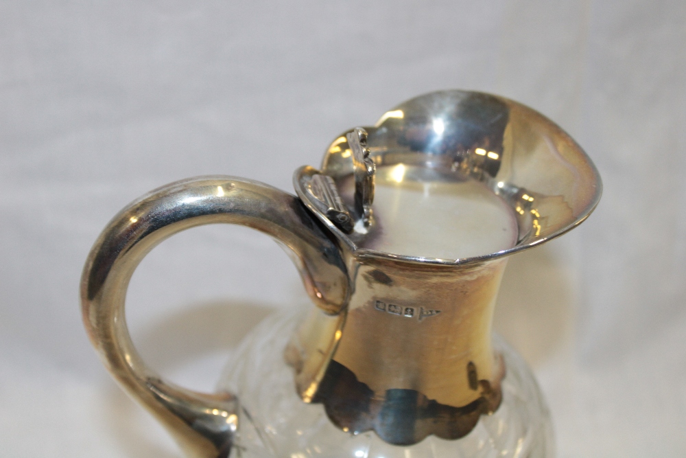 A George V cut-glass and silver mounted claret jug with silver handle and hinged top, 8½" high, - Image 2 of 2