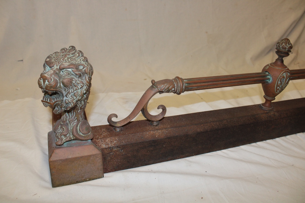 A Victorian brass mounted iron rectangular fire-fender with raised lion's mask decoration and - Image 2 of 3