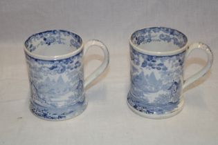 A pair of 19th century Staffordshire pottery half pint tankards with blue and white landscape