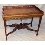 A reproduction mahogany tray-top rectangular occasional table with pierced gallery on square-shaped