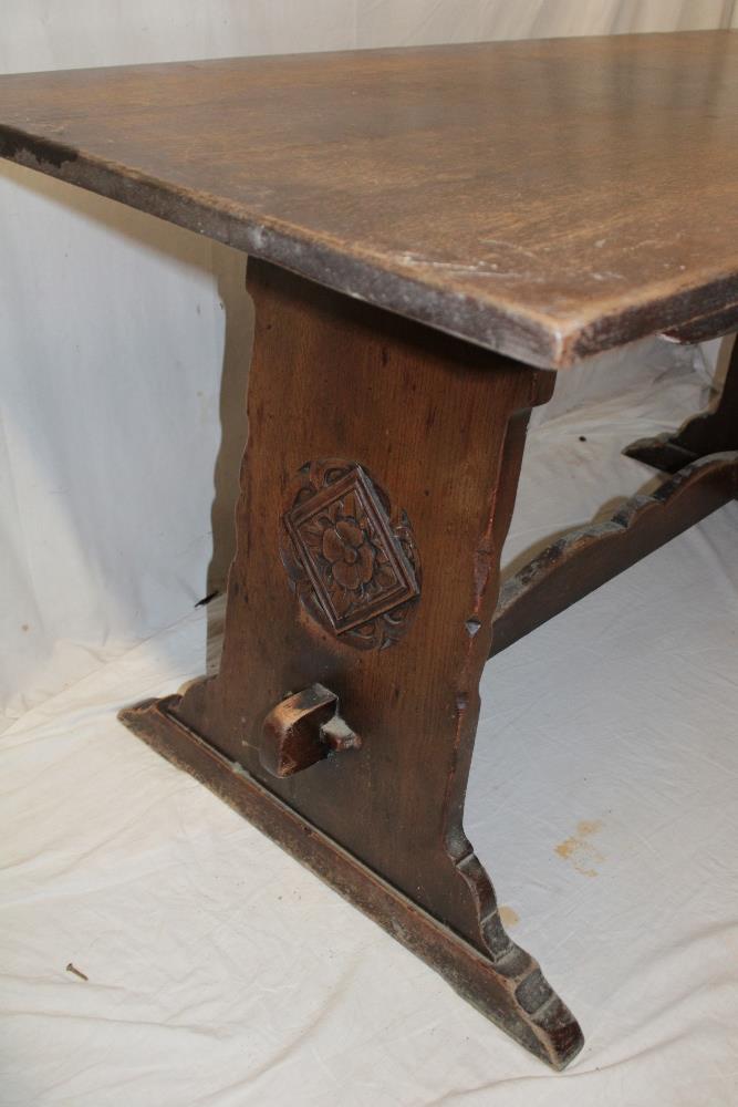 A rustic carved oak rectangular refectory dining table, the ends with floral emblems, - Image 2 of 2