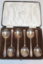 A set of six George V silver dessert spoons,
